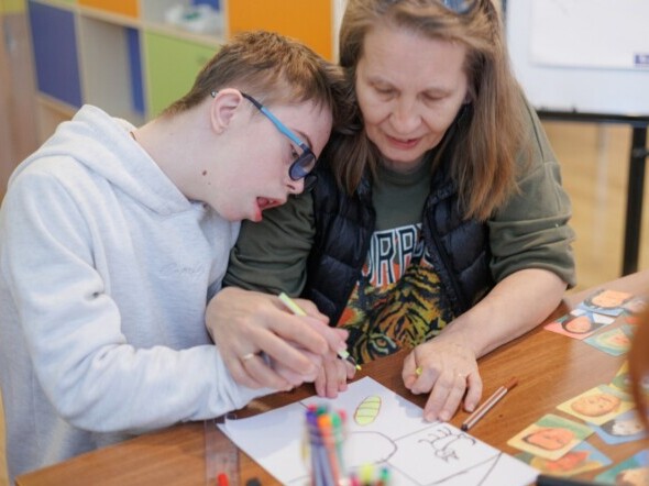 An image of a mother and child while painting